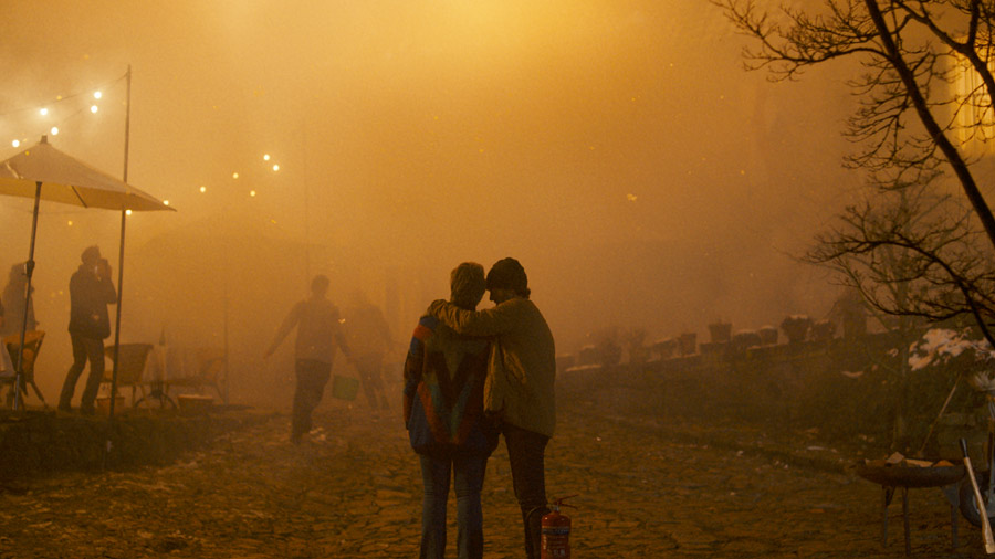 Film still: a couple amid a fire blaze