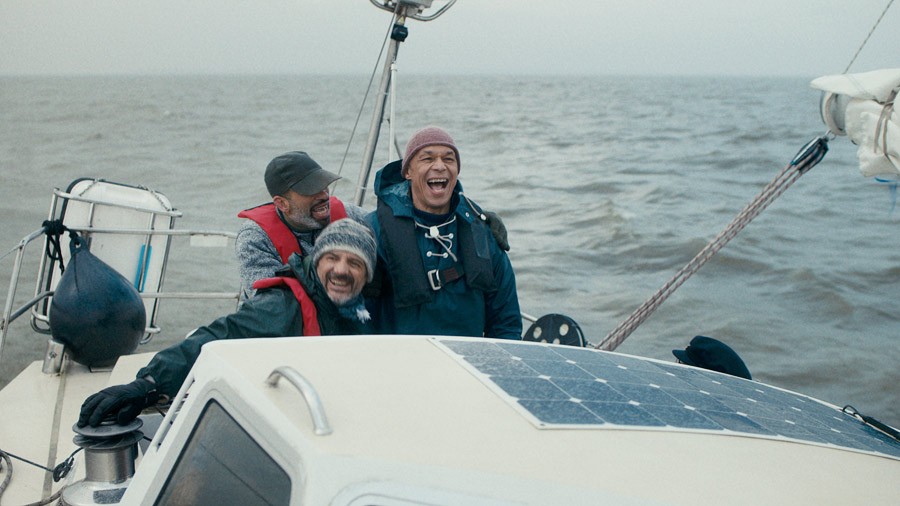 Film still: three men in a boat, excited