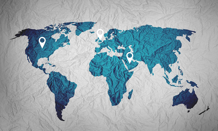 title image: A world map on wrinkled paper and location markers